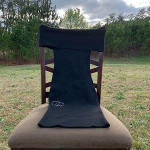 Black, fitted, off the shoulder, med-length dress.